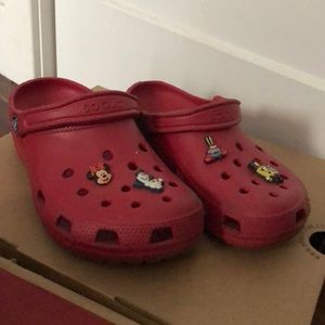 Red Crocs shoes with charms